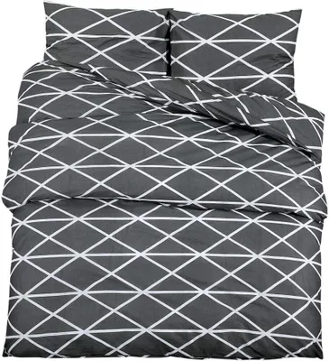 A neatly folded bedding set with a geometric pattern.