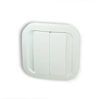 A white, two-button light switch on a white background.