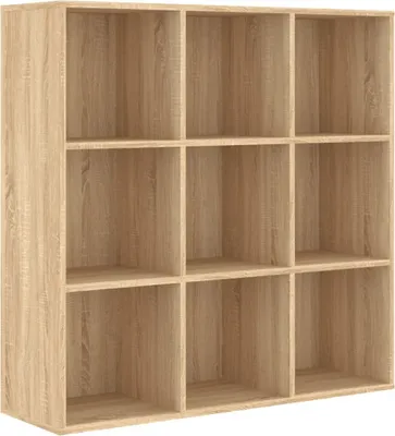 A wooden bookshelf with multiple compartments against a white background.