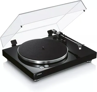 A black turntable with its dust cover open, shown from a diagonal angle against a white background.