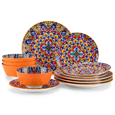 A set of ceramic plates and bowls with a colorful, intricate pattern.