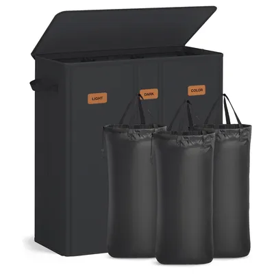 A black laundry hamper with three compartments, each labeled 'LIGHT', 'DARK', and 'COLOR'. Three black laundry bags are shown in front of the hamper.