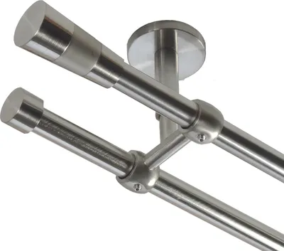 A close-up, angled view of a double curtain rod system mounted to a ceiling.