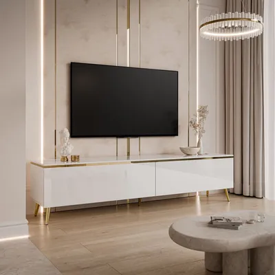 A modern living room with a white, high-gloss TV cabinet and a large flat-screen TV mounted on the wall.