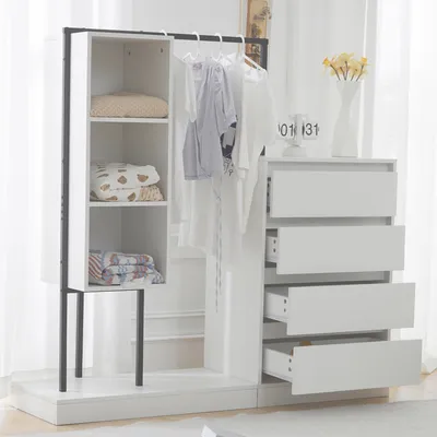 A white wardrobe set with a hanging rod and drawers, set against a light background with sheer curtains.