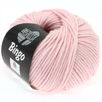 A ball of pink yarn with a black label.