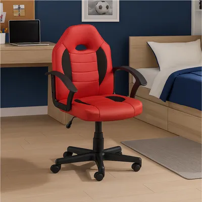 A red and black ergonomic gaming chair is shown in a bedroom setting, next to a bed and a desk with a laptop.