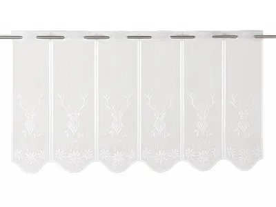 A white lace curtain with a deer motif hanging on a curtain rod.