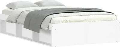 A white bed frame with storage drawers, shown with bedding.