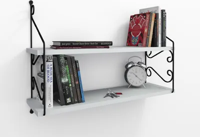 A white wall shelf with books and an alarm clock on it.