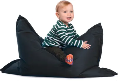 A toddler sits on a black beanbag chair.
