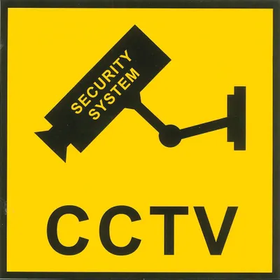 A yellow sign with a black graphic of a security camera and the text 'CCTV' below it.