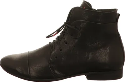A side view of a black leather boot.