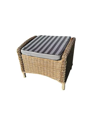 A woven ottoman with a striped cushion on a white background.