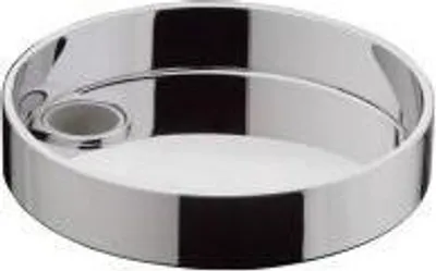 A shiny, round soap dish with a holder for a bar of soap.