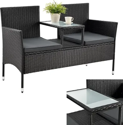 A black polyrattan garden bench with gray cushions and a small integrated table.