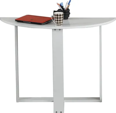 A white semi-circular desk with a laptop, a mug, and pens in a holder.