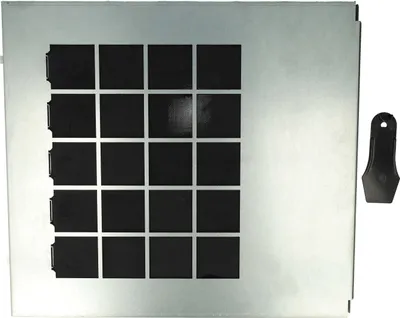 A metal panel with a grid of black squares and a black plastic tool.