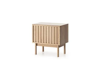 A wooden nightstand with a slatted front is shown against a white background.