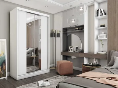 A bedroom scene featuring a large white wardrobe with mirrored doors, a dressing table with a mirror, and a bed.