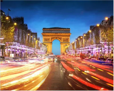 Produktbild von Wallario Poster - Arc de triomphe in Paris bei Nacht, Kunstdruck Größe: 40 x 50 cm