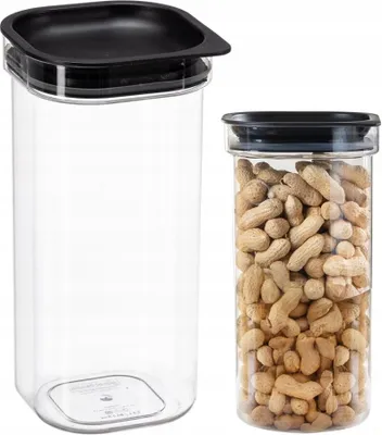 Two clear plastic storage containers with black lids are shown against a white background. One container is empty, and the other is filled with peanuts.