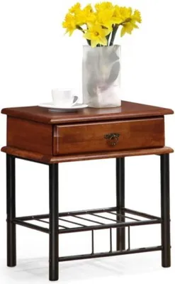 A wooden nightstand with a drawer and a lower shelf, decorated with a vase of yellow flowers and a teacup.