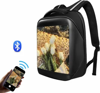 A black backpack with an LED display showing a picture of white tulips, next to icons representing Bluetooth and a smartphone connected via Wi-Fi.