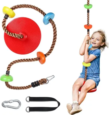 A child is shown using a rope swing with a disc seat and colorful climbing holds.