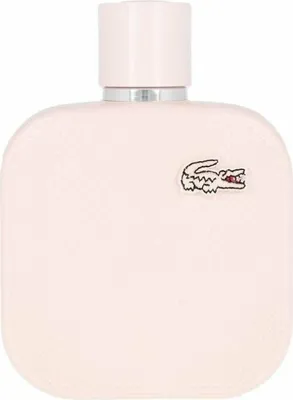A close-up studio shot of a pink perfume bottle with a silver cap and a small crocodile logo.