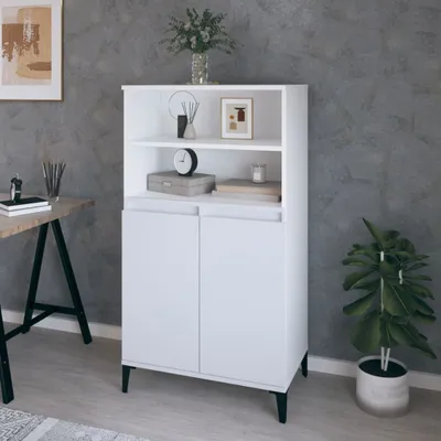 A white cabinet with shelves and doors, placed in a room with gray walls and a desk. It is decorated with a vase of flowers, a clock, and a framed picture.