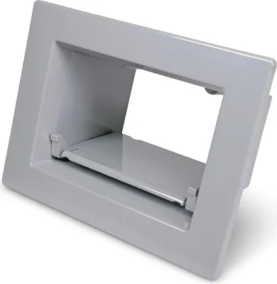 A light gray plastic skimmer insert with a rectangular opening and a shelf-like projection inside.