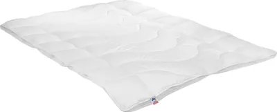 A white comforter is shown lying flat on a white background.