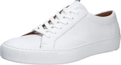 A white leather sneaker is shown from a side angle against a white background.