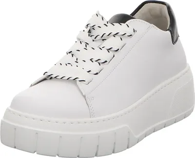 A white low-top sneaker with black accents and black and white patterned laces is shown against a white background.