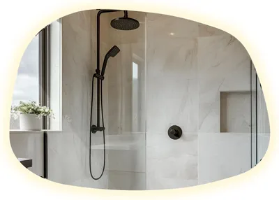 A modern bathroom shower with a black shower fixture and marble-like tiles.