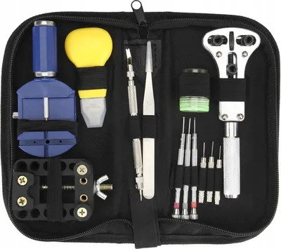 A set of watch repair tools laid out in a black case.