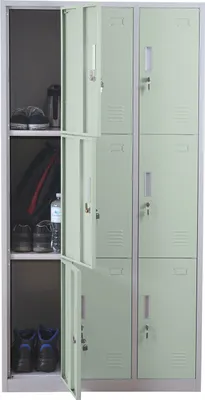 A light green metal locker with multiple compartments, some open, showing shoes and a water bottle inside.