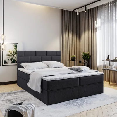 A bedroom scene with a bed as the main focus.