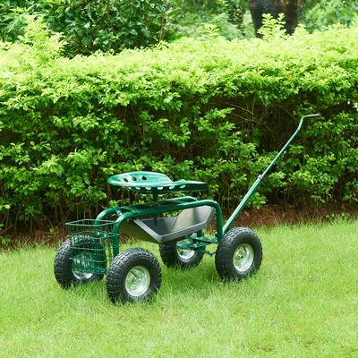 A garden cart with a seat and basket sits on a grassy lawn in front of a green hedge.