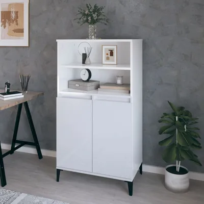 A white highboard is shown in a room with a gray textured wall and a wooden desk. A plant is visible to the right of the highboard.