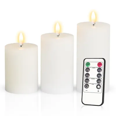 Three white LED candles of varying heights are displayed on a white background, with a remote control placed in front of the rightmost candle.