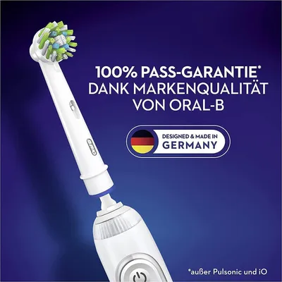A close-up of an Oral-B electric toothbrush head and part of the handle, with marketing text and a German flag emblem.