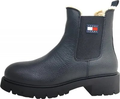 A single black Tommy Hilfiger Chelsea boot is shown against a white background.