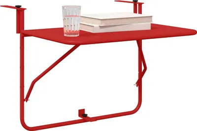 A red metal balcony table with a glass of water and two books on it, set against a white background.