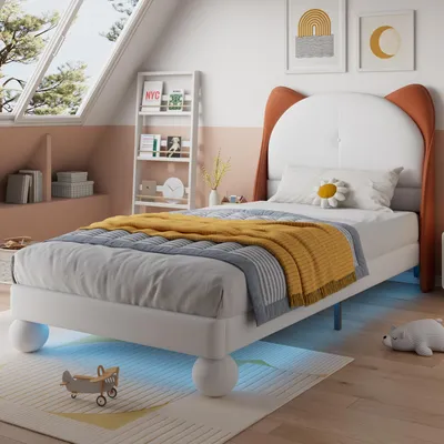A child's bedroom with a bed, bookshelf, and window.