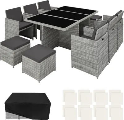 A rattan outdoor furniture set including a table, chairs, and ottomans, with a protective cover and cushions shown separately.
