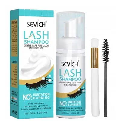 A bottle of lash shampoo and a brush are displayed next to its packaging.