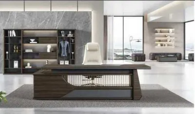 A modern office with a large desk, chair, and shelving unit.