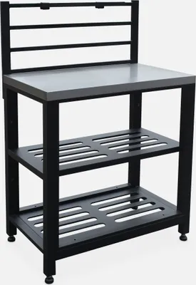 A black metal kitchen rack with a gray top and two slatted shelves.